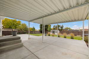 View of patio / terrace featuring a storage unit