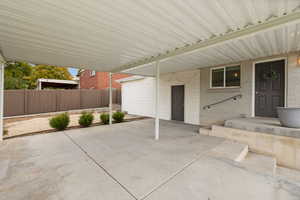 View of patio featuring a carport