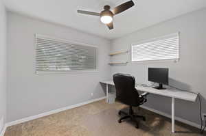 Office with carpet and ceiling fan