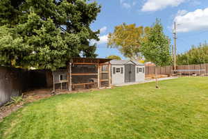 View of yard featuring a storage shed