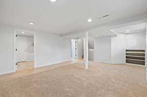 Basement featuring light hardwood / wood-style floors