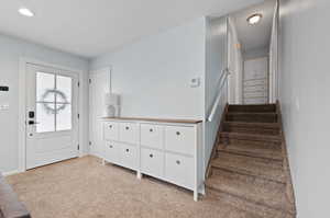 View of carpeted foyer