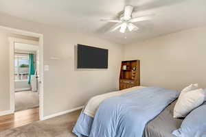 Bedroom with light carpet and ceiling fan