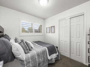 Bedroom 2 with a closet and dark carpet