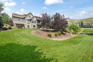 View of yard featuring a utility garage