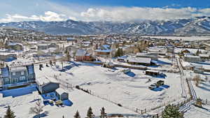 Snowy aerial view featuring a mountain view