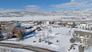 Snowy aerial view with a mountain view