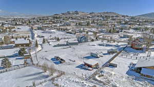 Snowy aerial view with a mountain view