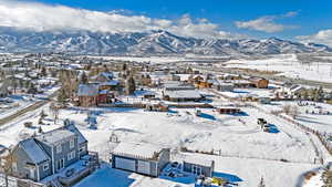 Snowy aerial view with a mountain view