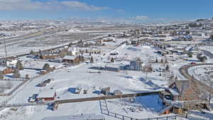 Snowy aerial view featuring a mountain view