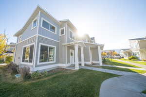 View of front of property with a front lawn