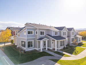 View of front of property with a front yard