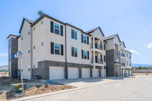View of building exterior with a garage