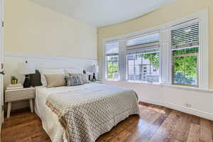 Bedroom with hardwood / wood-style flooring