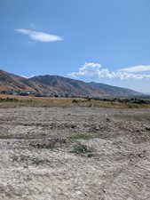 View of mountain background featuring rural landscape