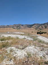 View of mountain background featuring rural landscape