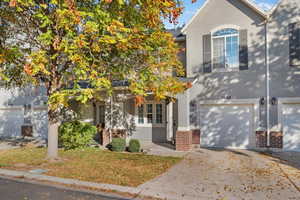 Obstructed view of property with a garage