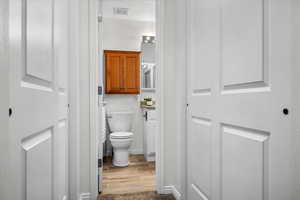 Bathroom featuring toilet and hardwood / wood-style flooring