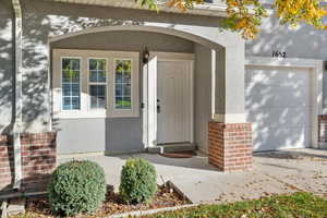 Entrance to property with a garage