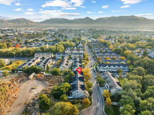 Birds eye view of property with a mountain view