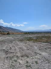 View of mountain backdrop with rural landscape