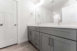 Bathroom with vanity and hardwood / wood-style floors