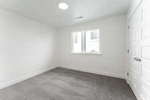 View of carpeted spare room