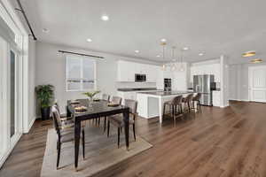 Dining area featuring sink and wood-type flooring, Virtually Staged