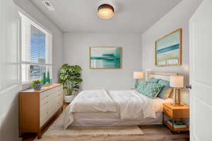 Bedroom with hardwood / wood-style flooring, Virtually Staged