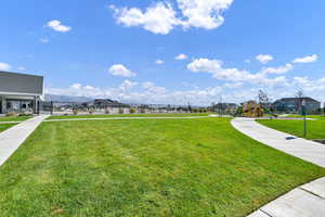 View of yard featuring a mountain view and a playground