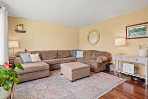 Living room with light hardwood / wood-style floors