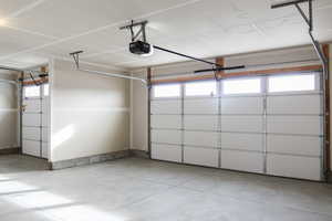 Garage featuring a garage door opener