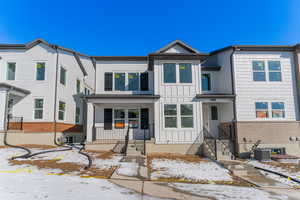 Multi unit property featuring cooling unit and covered porch