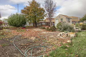 View of yard featuring a storage unit