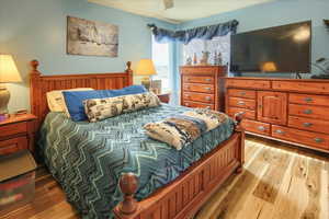 Bedroom featuring light wood-type flooring and ceiling fan