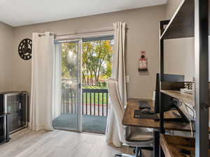 Doorway featuring wine cooler and light hardwood / wood-style floors