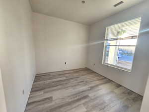 Spare room with light hardwood / wood-style floors