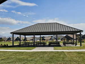 Surrounding community with a gazebo and a lawn