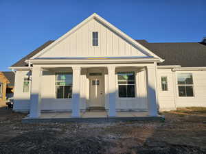 View of front facade featuring covered porch