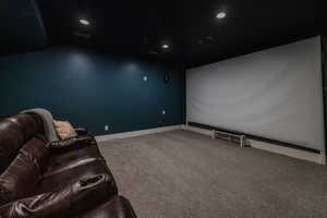 Cinema room featuring carpet flooring