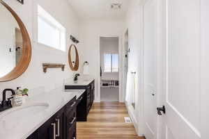 Bathroom with vanity and hardwood / wood-style flooring