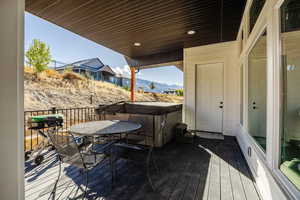 Wooden terrace featuring a mountain view