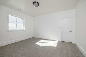 Empty room with carpet floors