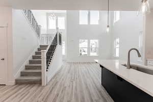 Interior space featuring a sink, light wood-style flooring, and light countertops