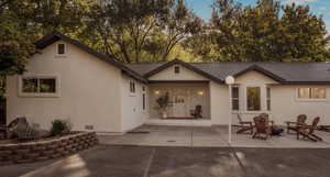 Back of property featuring a patio area