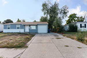 Ranch-style house featuring a garage