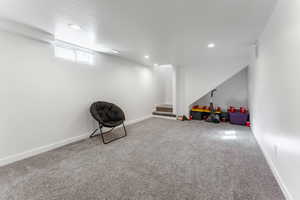 Game room with carpet flooring