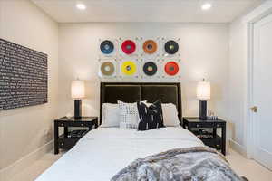 Bedroom with light colored carpet