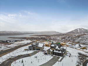 Snowy aerial view featuring a mountain view