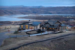 Property view of mountains with a water view